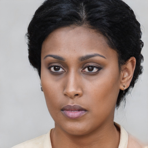 Neutral latino young-adult female with short  black hair and brown eyes