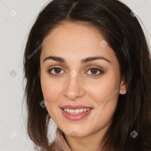 Joyful white young-adult female with long  brown hair and brown eyes