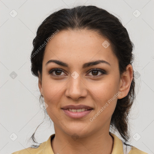 Joyful latino young-adult female with medium  brown hair and brown eyes