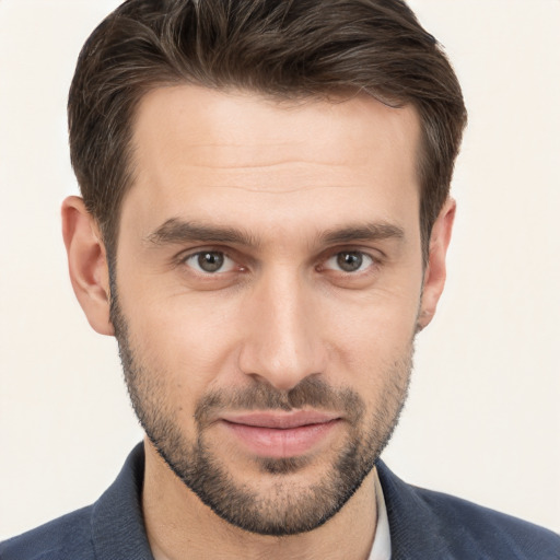 Joyful white young-adult male with short  brown hair and brown eyes