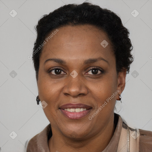 Joyful black adult female with short  brown hair and brown eyes