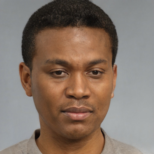 Neutral black young-adult male with short  brown hair and brown eyes
