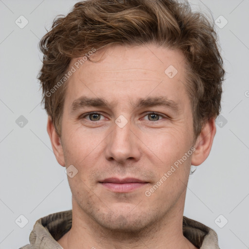 Joyful white adult male with short  brown hair and grey eyes