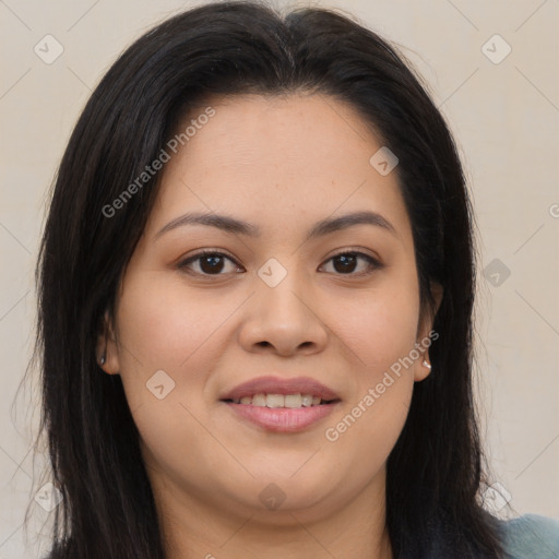 Joyful latino young-adult female with long  brown hair and brown eyes