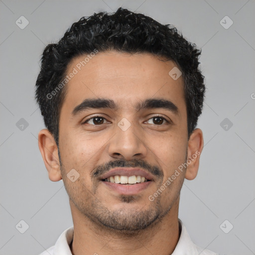 Joyful latino young-adult male with short  black hair and brown eyes