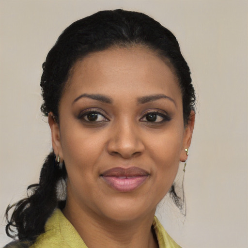 Joyful black young-adult female with medium  black hair and brown eyes