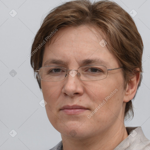 Joyful white adult female with short  brown hair and grey eyes