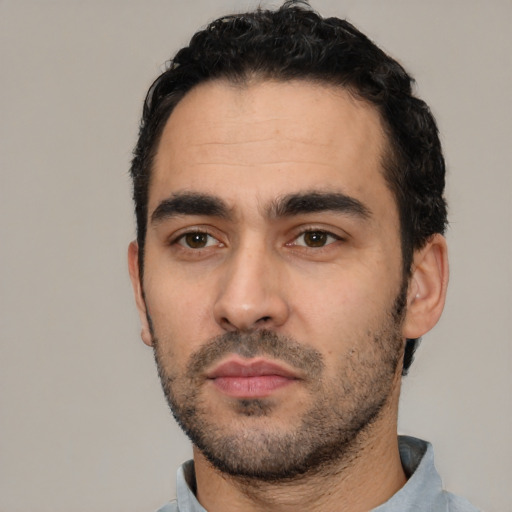 Neutral white young-adult male with short  black hair and brown eyes