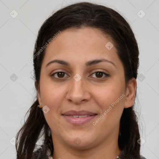 Joyful white young-adult female with long  brown hair and brown eyes