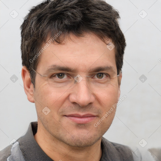 Joyful white adult male with short  brown hair and grey eyes