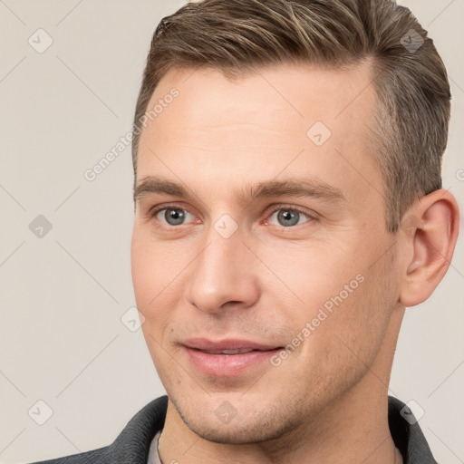 Joyful white young-adult male with short  brown hair and brown eyes