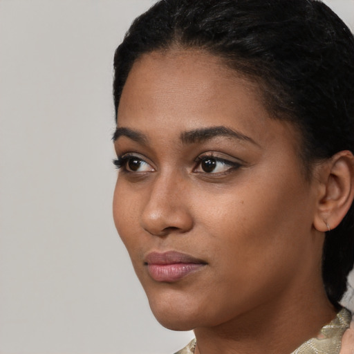 Neutral black young-adult female with short  black hair and brown eyes