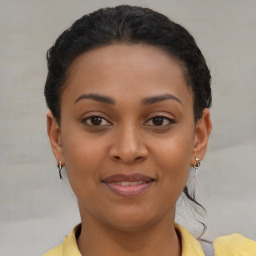 Joyful latino young-adult female with short  brown hair and brown eyes