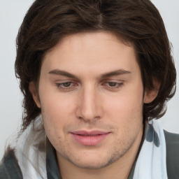 Joyful white young-adult male with medium  brown hair and brown eyes