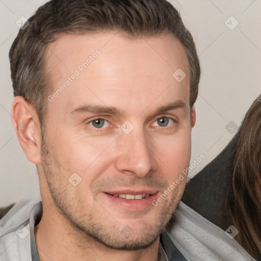 Joyful white adult male with short  brown hair and brown eyes