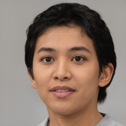 Joyful asian young-adult female with short  black hair and brown eyes