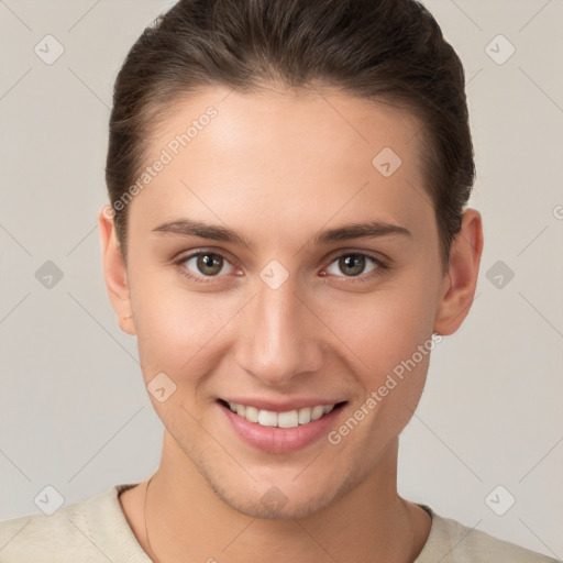 Joyful white young-adult female with short  brown hair and brown eyes