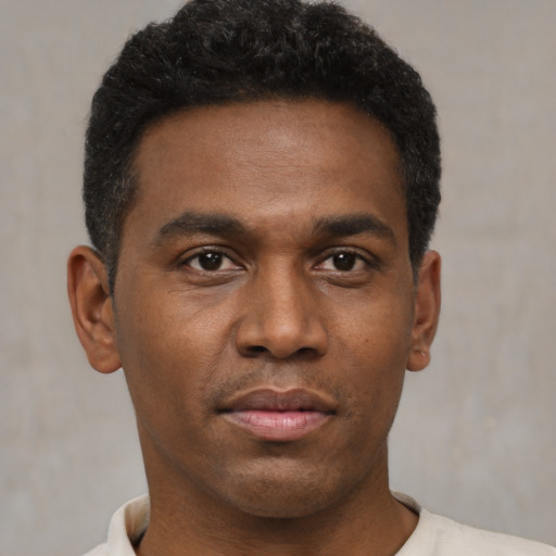 Neutral black young-adult male with short  black hair and brown eyes