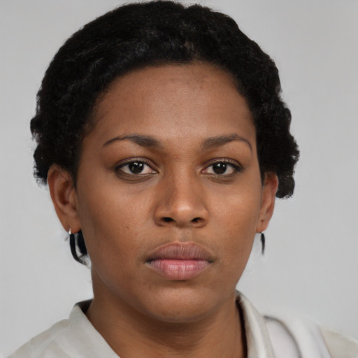 Neutral black young-adult female with short  brown hair and brown eyes
