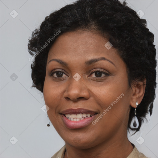 Joyful black adult female with short  brown hair and brown eyes