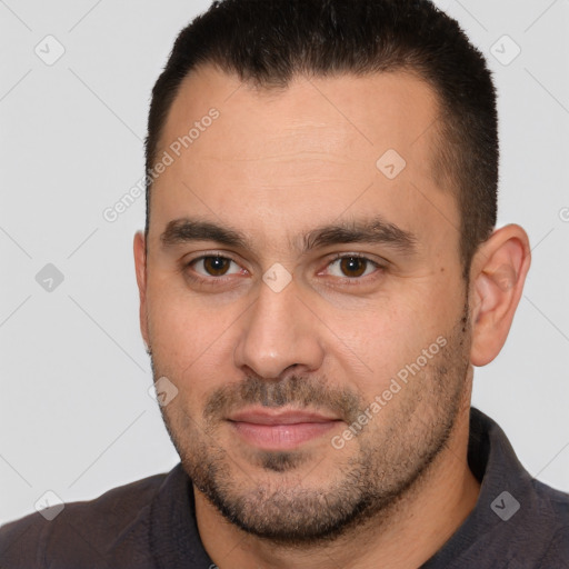 Joyful white young-adult male with short  brown hair and brown eyes