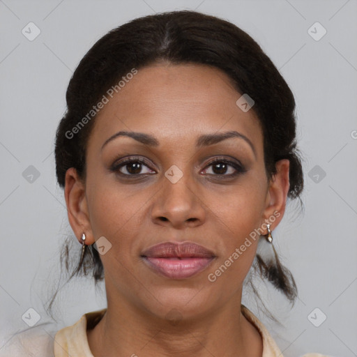 Joyful black adult female with medium  brown hair and brown eyes