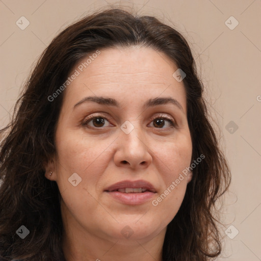 Joyful white adult female with long  brown hair and brown eyes