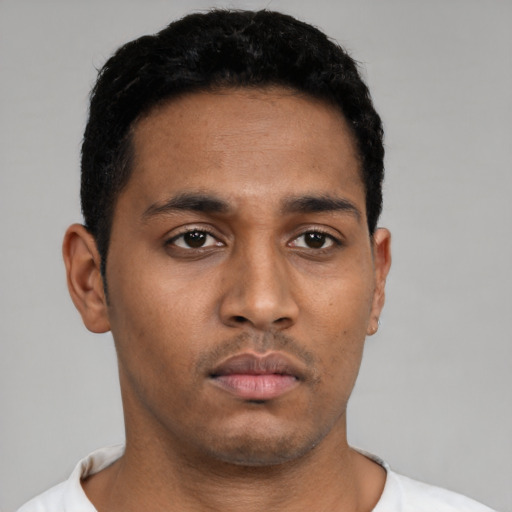 Neutral latino young-adult male with short  black hair and brown eyes