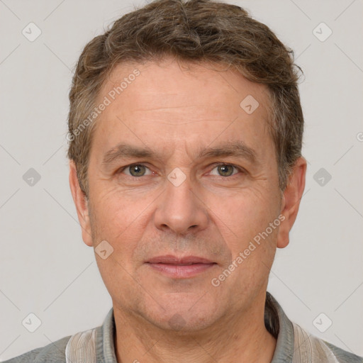 Joyful white adult male with short  brown hair and grey eyes