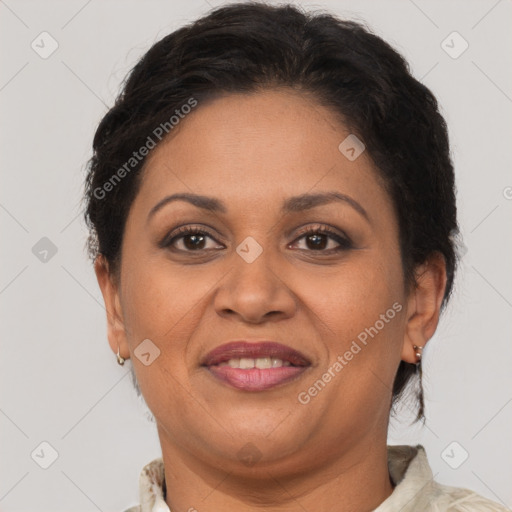 Joyful latino adult female with short  brown hair and brown eyes