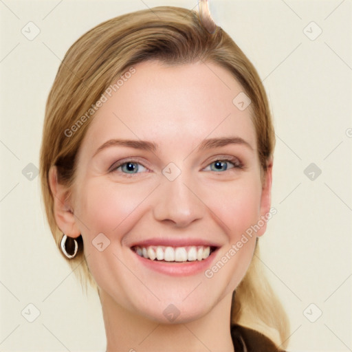 Joyful white young-adult female with medium  brown hair and blue eyes