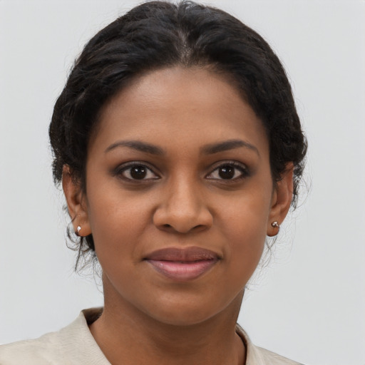 Joyful black young-adult female with short  brown hair and brown eyes