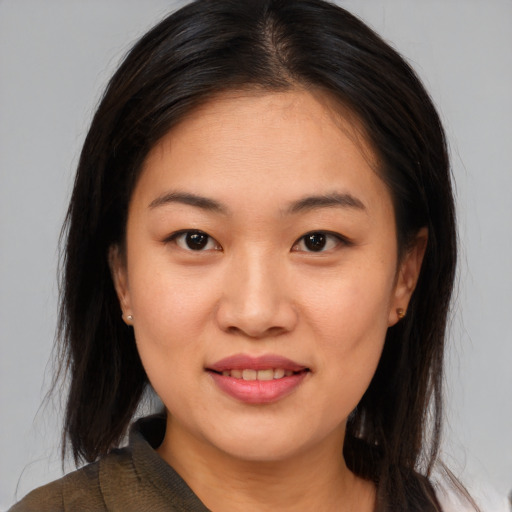Joyful asian young-adult female with medium  brown hair and brown eyes