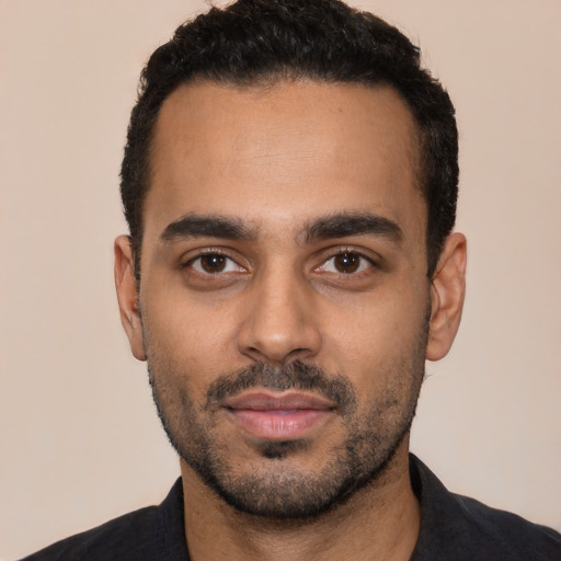 Neutral latino young-adult male with short  black hair and brown eyes