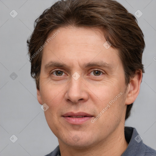 Joyful white adult male with short  brown hair and grey eyes