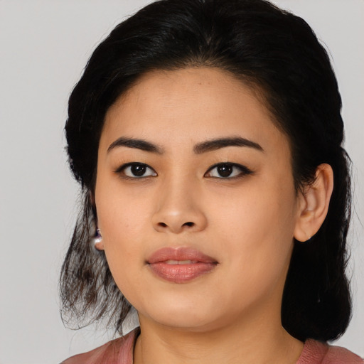 Joyful asian young-adult female with medium  black hair and brown eyes