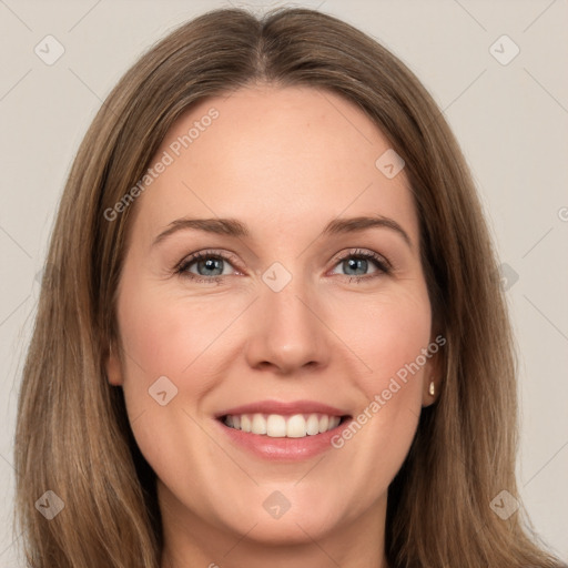 Joyful white young-adult female with long  brown hair and green eyes