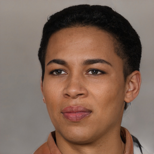 Joyful latino young-adult female with short  black hair and brown eyes