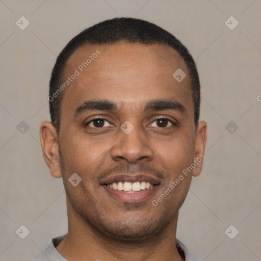 Joyful latino young-adult male with short  brown hair and brown eyes