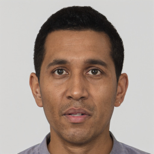 Neutral black adult male with short  black hair and brown eyes