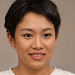 Joyful asian young-adult female with short  brown hair and brown eyes