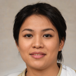 Joyful asian young-adult female with medium  brown hair and brown eyes