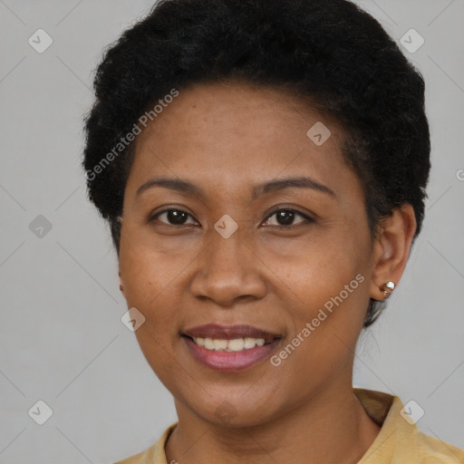 Joyful black young-adult female with short  brown hair and brown eyes