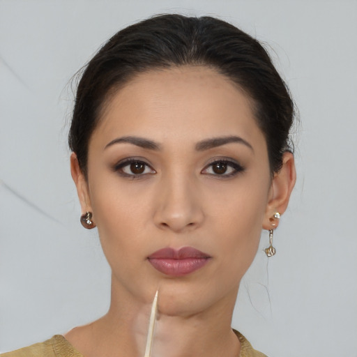Neutral latino young-adult female with medium  brown hair and brown eyes