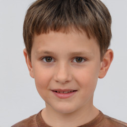 Joyful white child male with short  brown hair and brown eyes