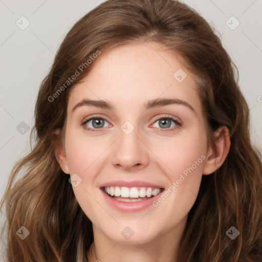 Joyful white young-adult female with long  brown hair and green eyes