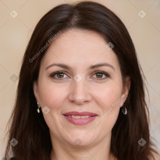 Joyful white adult female with long  brown hair and brown eyes