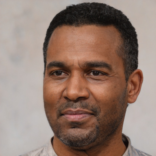 Neutral latino adult male with short  black hair and brown eyes