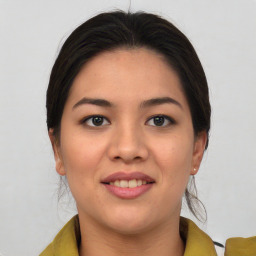 Joyful asian young-adult female with medium  brown hair and brown eyes