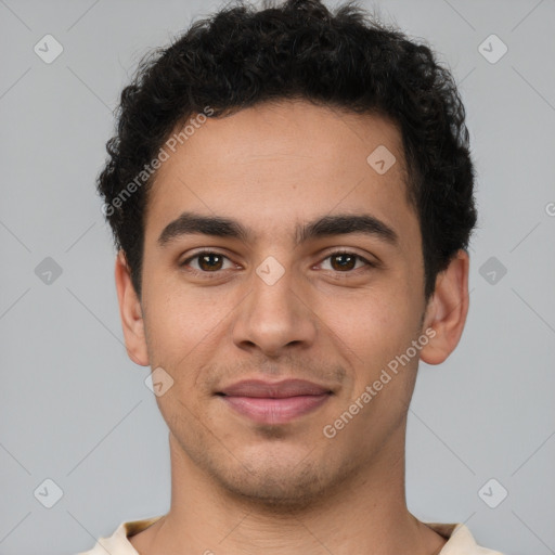 Joyful latino young-adult male with short  brown hair and brown eyes